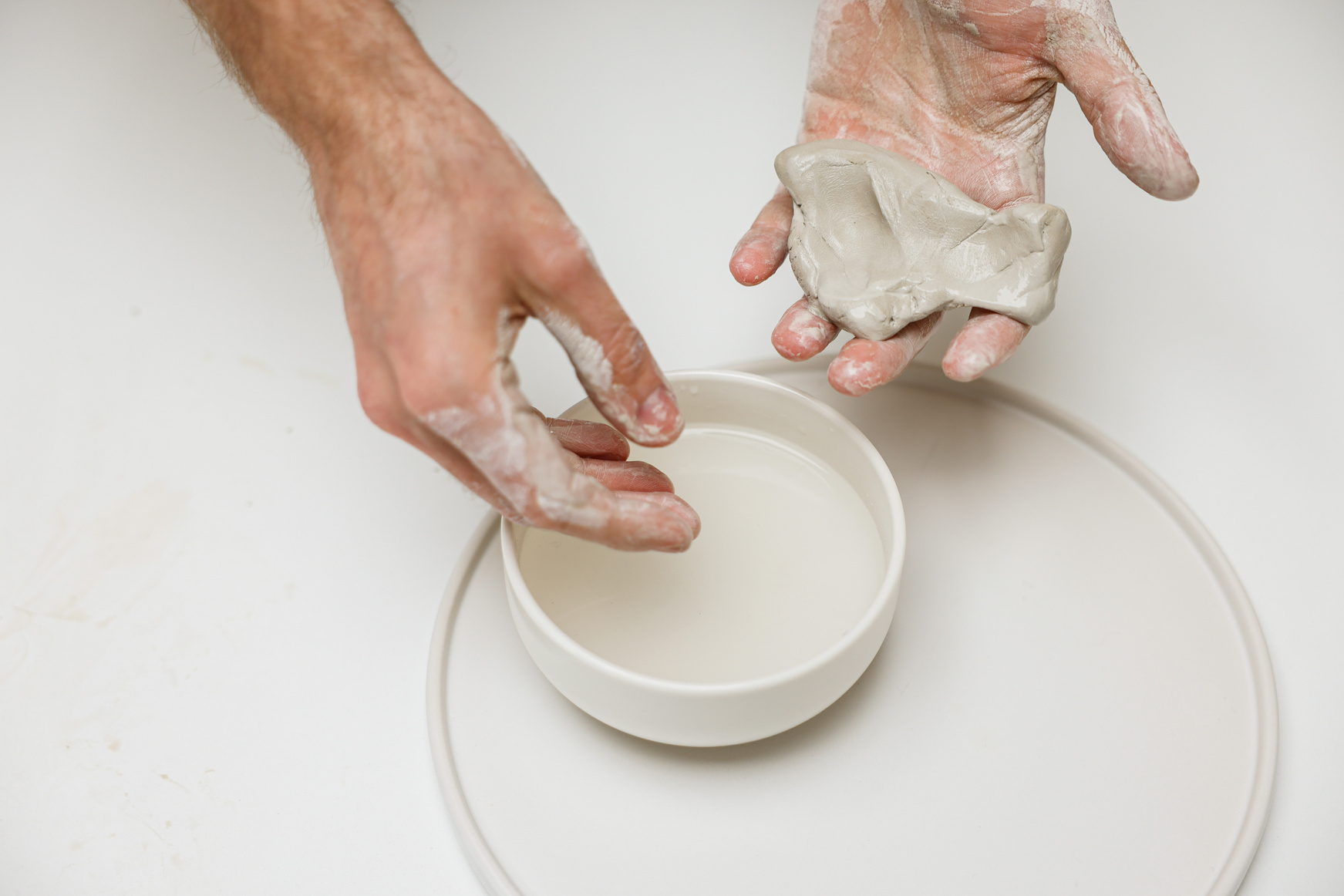 A Person Molding Clay